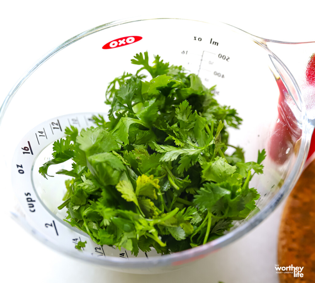 parsley in a measuring cup