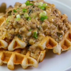 Savory Waffles and gravy recipe on white plate