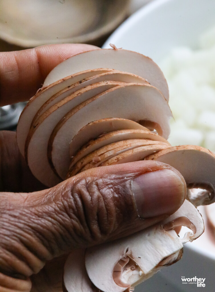  A handful of sliced portabello mushrooms. 