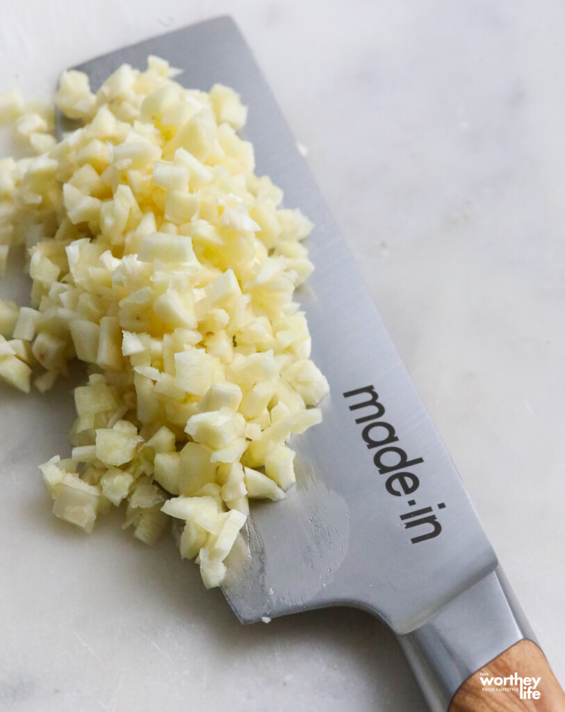 chopped garlic with Made In knife