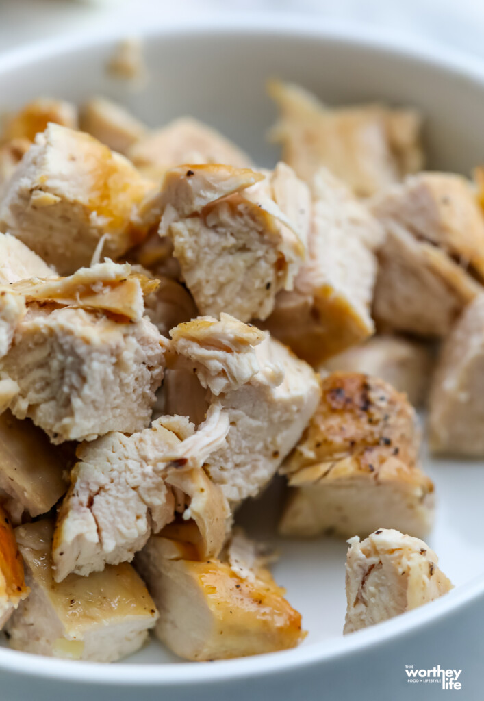 cubed chicken breasts on a white plate