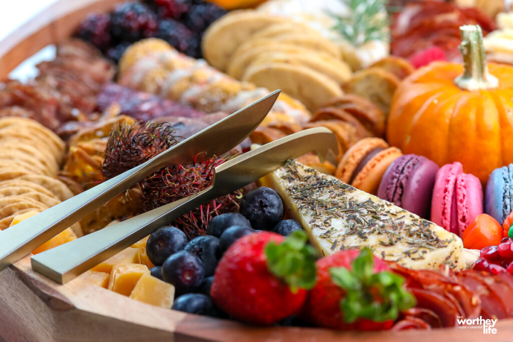 meats and cheeses on a grazing board