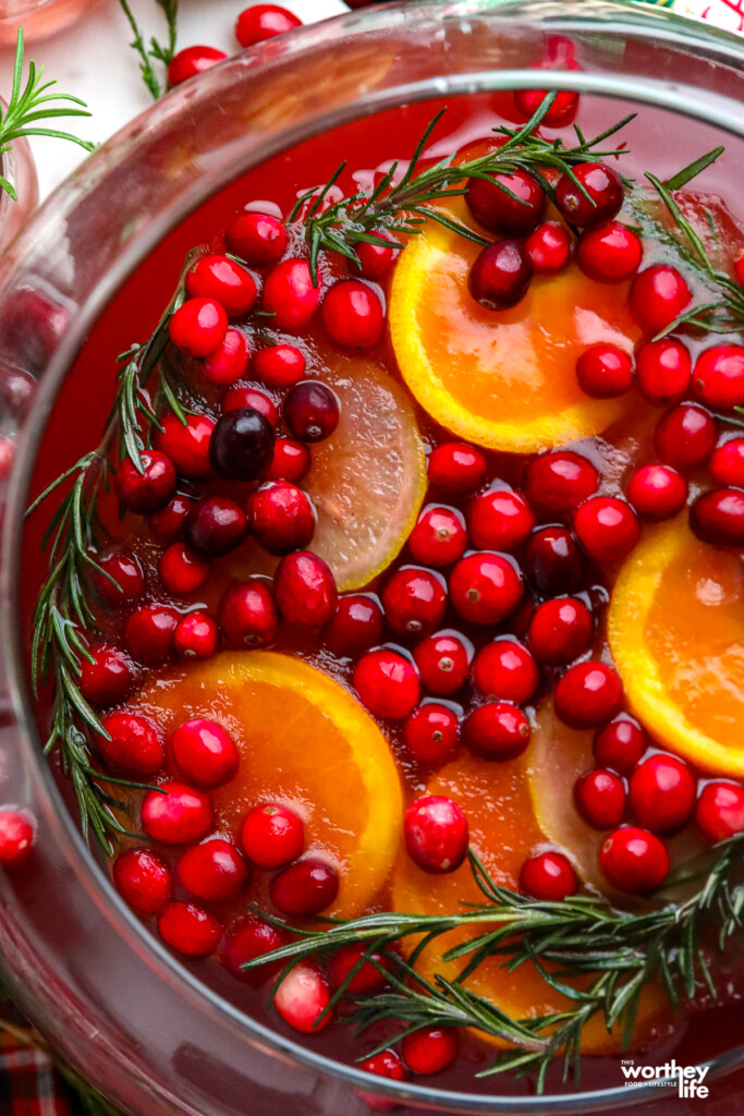 festive holiday punch with cranberries, apple cider and ginger ale